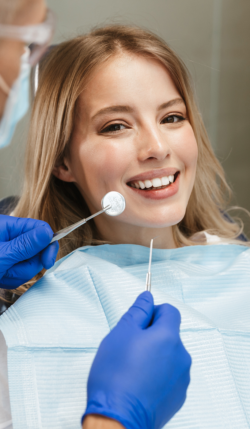 The image shows a modern dental or medical office interior with a dental chair, equipment, and a clean, professional environment.